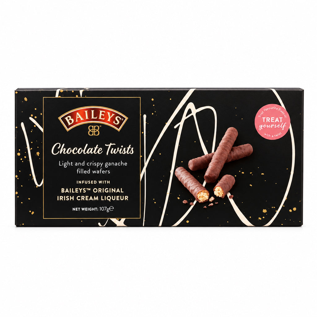 Baileys Chocolate Twists filled wafers in a rectangular box, placed on a marble countertop with a blurred kitchen background.