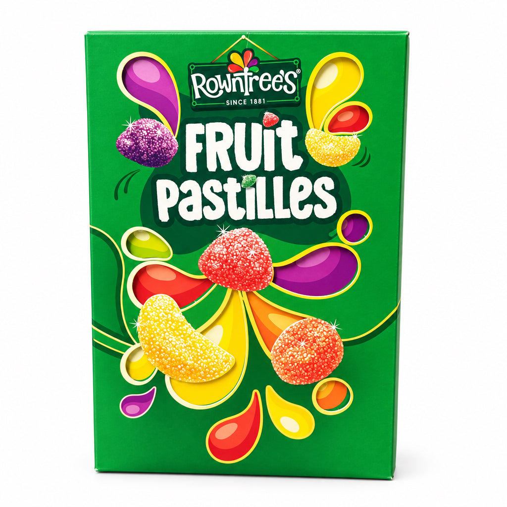 A green box of Rowntree's Fruit Pastilles candy stands on a stone countertop with a blurred wooden background.