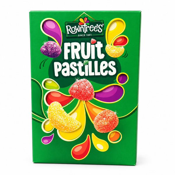 A green box of Rowntree's Fruit Pastilles candy stands on a stone countertop with a blurred wooden background.