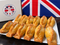A plate of golden-brown baked empanadas in front of a Union Jack flag, with a branded box reading 'Myers of Keswick' visible on the left.