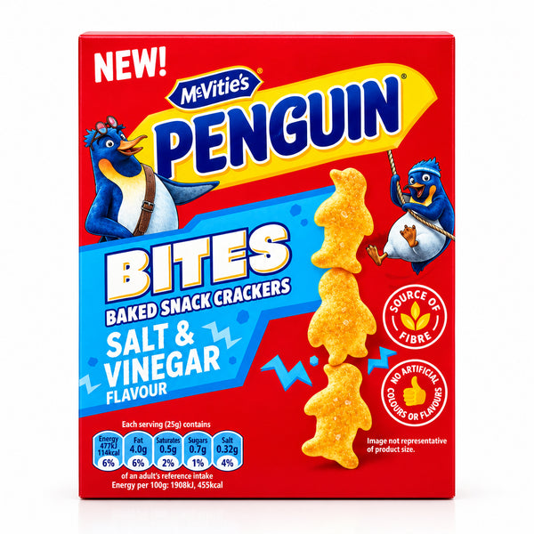 A box of MyVitie's Penguin Bites Salt & Vinegar flavored baked snack crackers, standing on a marble countertop with a blurred kitchen background and a red shopping basket.