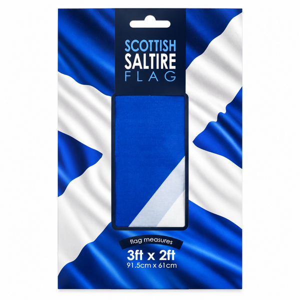 A packaged Scottish Saltire flag shown in retail packaging with a blue-and-white flag design background and a central cutout displaying the folded flag. Text on the package reads 'SCOTTISH SALTIRE FLAG' and 'flag measures 3ft x 2ft 91.