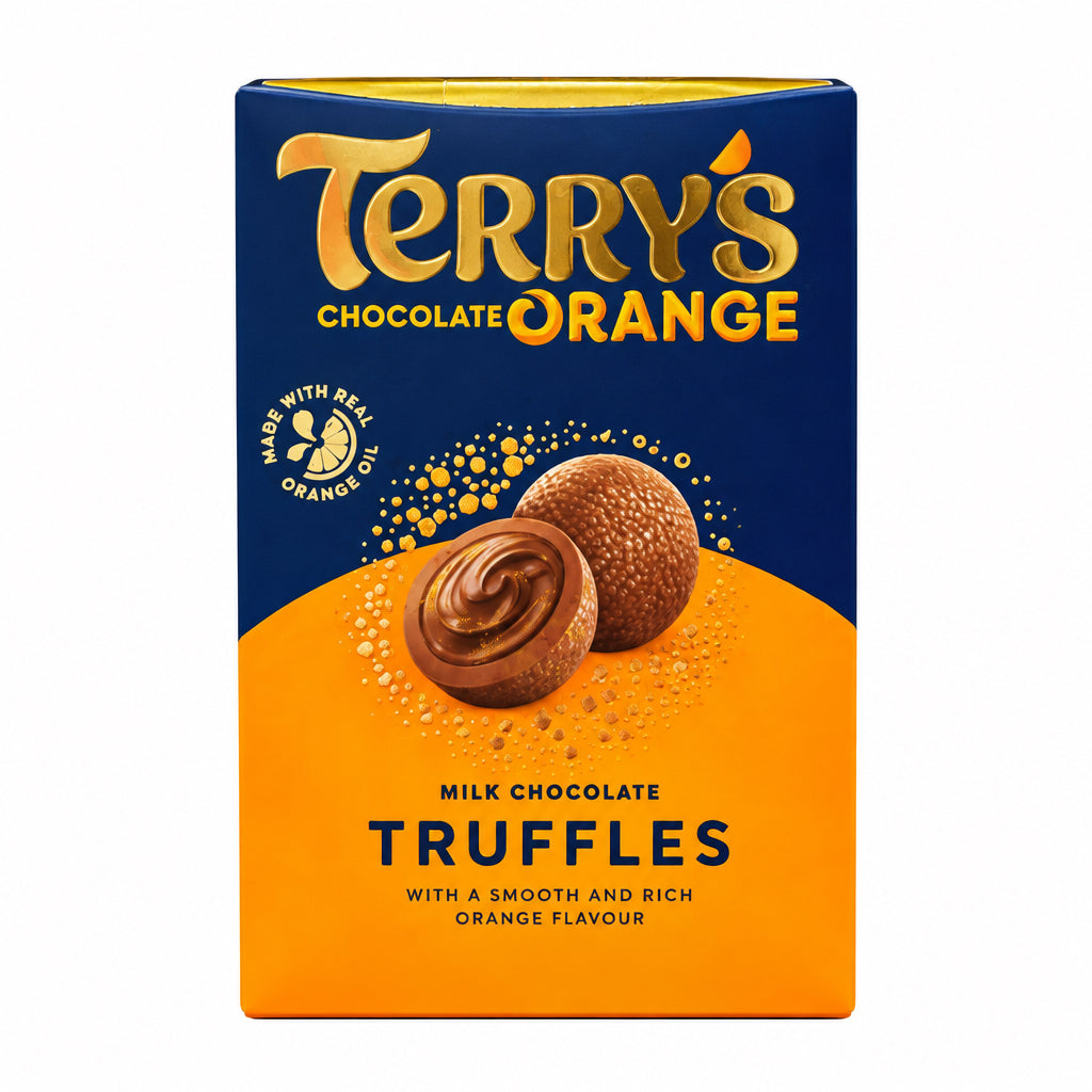 A box of Terry's Chocolate Orange Truffles standing on a wooden surface with a blurred store background.