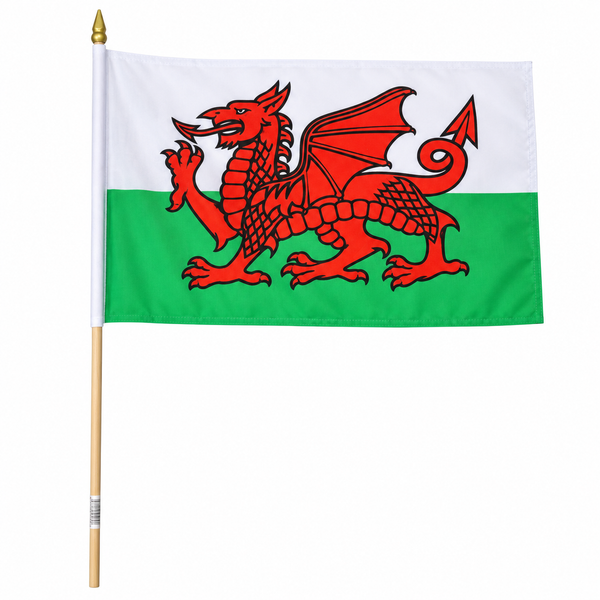 Wales flag on a wooden stick with a gold spear finial, featuring the red dragon on a white and green background, isolated on a white studio background.