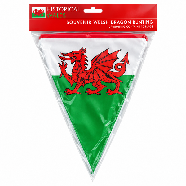 Packaged triangular Welsh flag bunting with a red header card reading 'Historical Wales Souvenir Welsh Dragon Bunting' and '12ft Bunting Contains 10 Flags'. The visible flag has a red dragon on a white upper section and green lower section.
