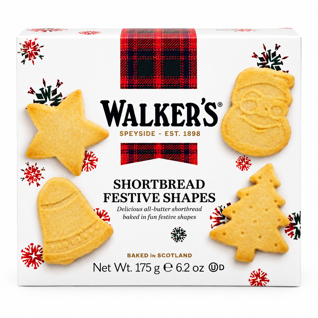 A boxed food product on a plain white background. The package is white with red and black plaid bands, snowflake graphics, and illustrations of four shortbread cookies shaped like a star, bell, tree, and Santa face.