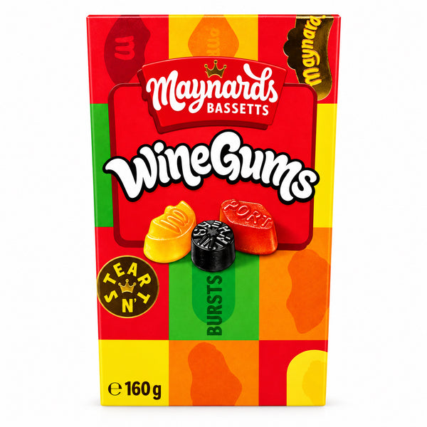 A box of Maynards Bassetts Wine Gums candy, featuring a colorful red, orange, and yellow checkered design with illustrations of wine-themed gummy candies, set on a light wooden surface.